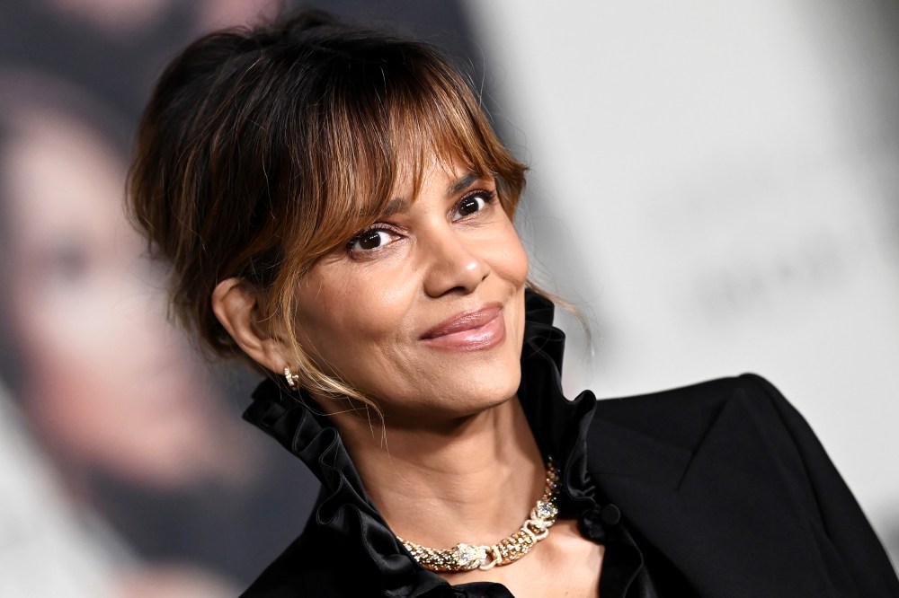 Halle Berry poses for photos at a red carpet event.