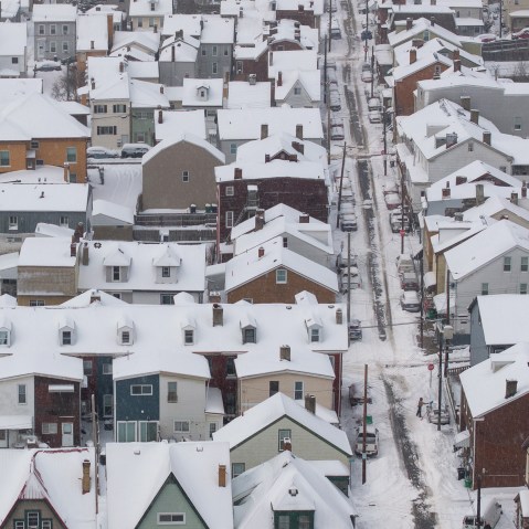 An aerial view of snow-covered homes.