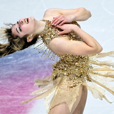 Alysa Liu bends backwards, her hands on her chest, while skating during the 2026 Winter Olympics.