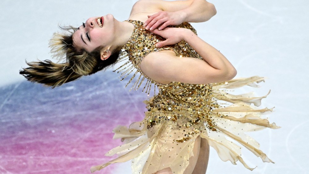 Alysa Liu bends backwards, her hands on her chest, while skating during the 2026 Winter Olympics.