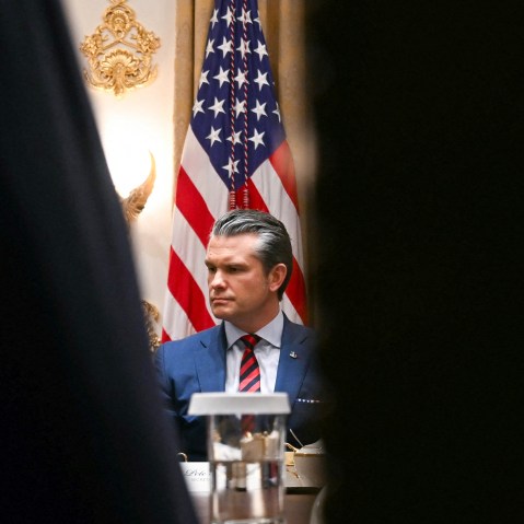 Pete Hegseth is seen looking serious and upset.