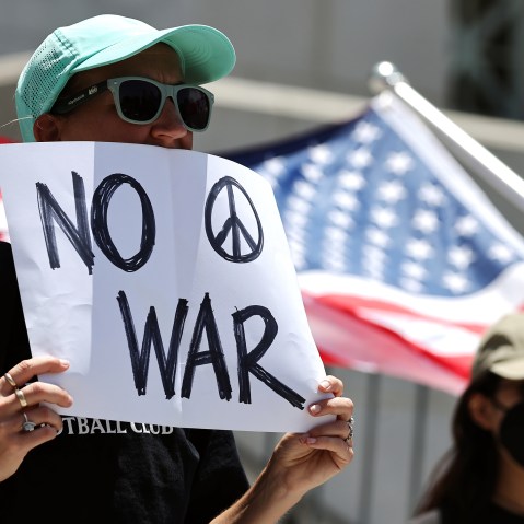 Demonstrators gather outside City Hall during a rally opposing the United States' strikes on Iran on June 22, 2025.