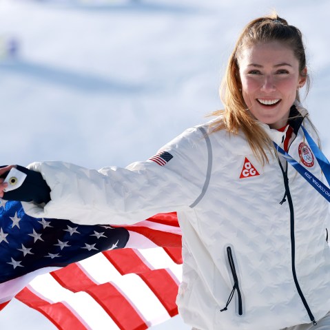 Gold medalist Mikaela Shiffrin of Team United States poses for a photo with a flag after the medal ceremony following the Women's Slalom Run on day twelve of the Milano Cortina 2026 Winter Olympics at Tofane Alpine Skiing Center on February 18, 2026 in Cortina d'Ampezzo, Italy