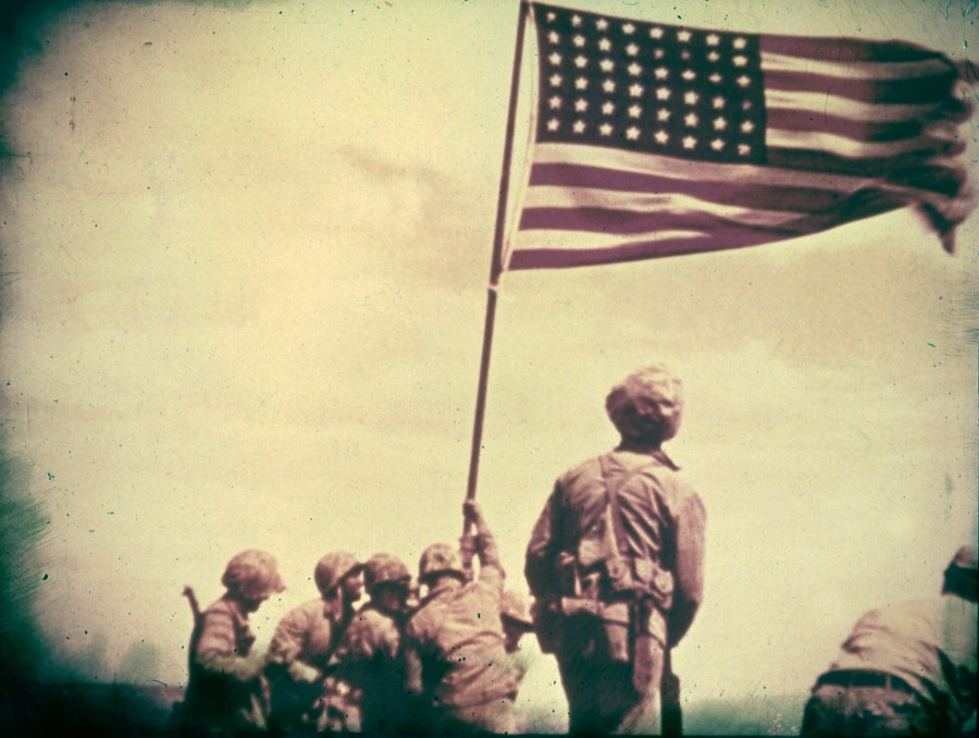A still from the film shot by Marine photographer Bill Genaust of soldiers raising the United States flag at Iwo Jima, February 23, 1945