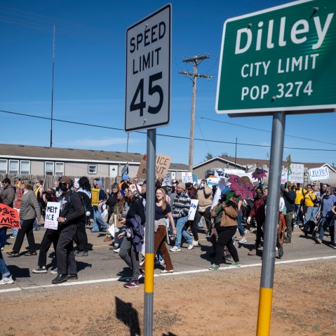 DILLEY, TEXAS - JANUARY 28: People protest against Immigration and Customs Enforcement as they march toward the South Texas Family Residential Center on January 28, 2026 in Dilley, Texas. A federal judge temporarily blocked the deportation of 5-year-old Liam Conejo Ramos and his father, Adrian Conejo Arias, who were arrested in Minneapolis after the father had picked the boy up from school. They were then taken to the South Texas Family Residential Center, an immigration detention center outside San Antonio, where they remain. (Photo by Joel Angel Juarez/Getty Images)