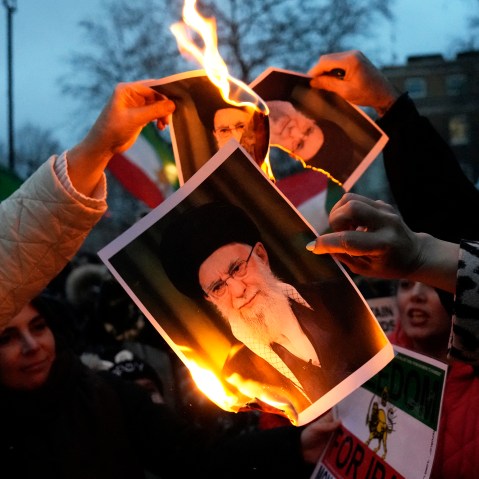 Protestors burn images of Ayatollah Ali Khamenei during a rally on Jan. 11, 2026 in central London.