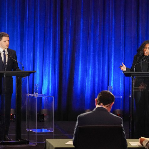 James Talarico, left and Jasmine Crockett seen on stage during a debate.