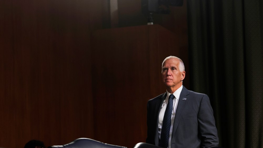 Thom Tillis stands.