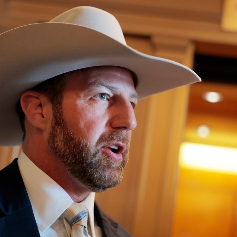 Markwayne Mullin wears a cream colored cowboy hat as he speaks.