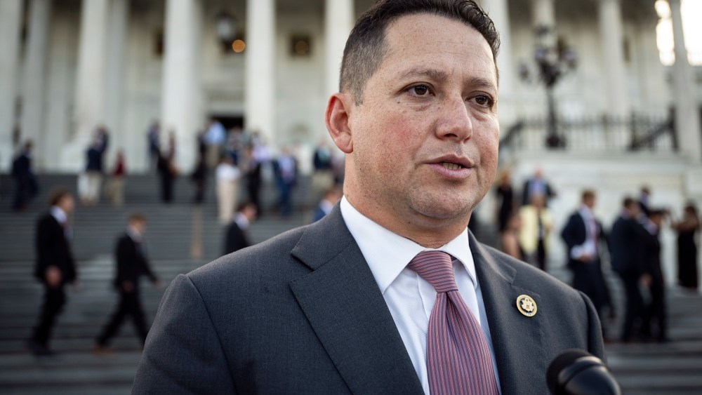 Tony Gonzales speaks into a microphone.