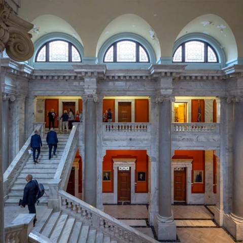 Legislators and visitors walk up the steps to the Senate chambers at the Kentucky state Capitol.