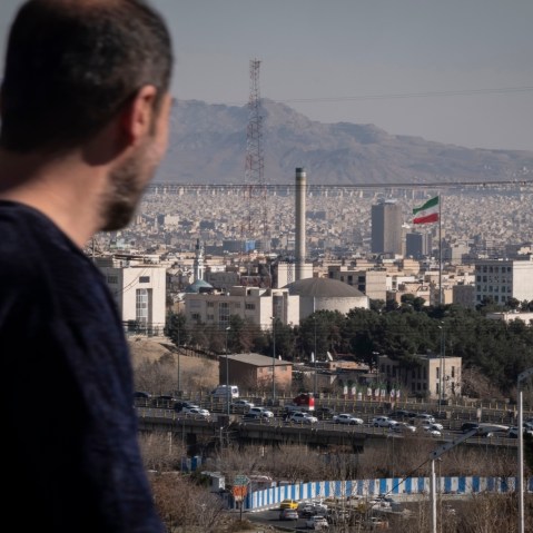 A man walks past a nuclear reactor in Tehran, Iran.