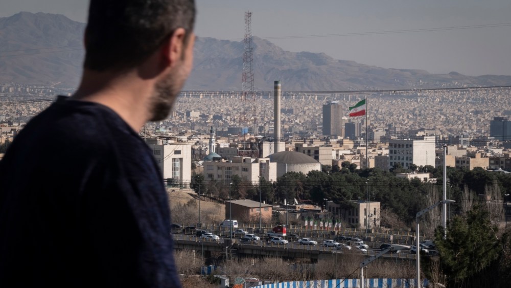 A man walks past a nuclear reactor in Tehran, Iran.