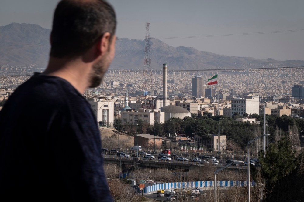 A man walks past a nuclear reactor in Tehran, Iran.