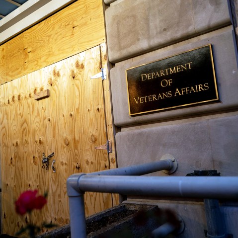 The door and windows of Department of Veterans Affairs are boarded up in preparation for possible election related protest in 2020.