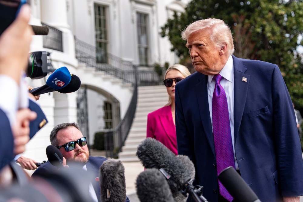 President Donald Trump speaks with reporters before departing on Marine One from the South Lawn of the White House.