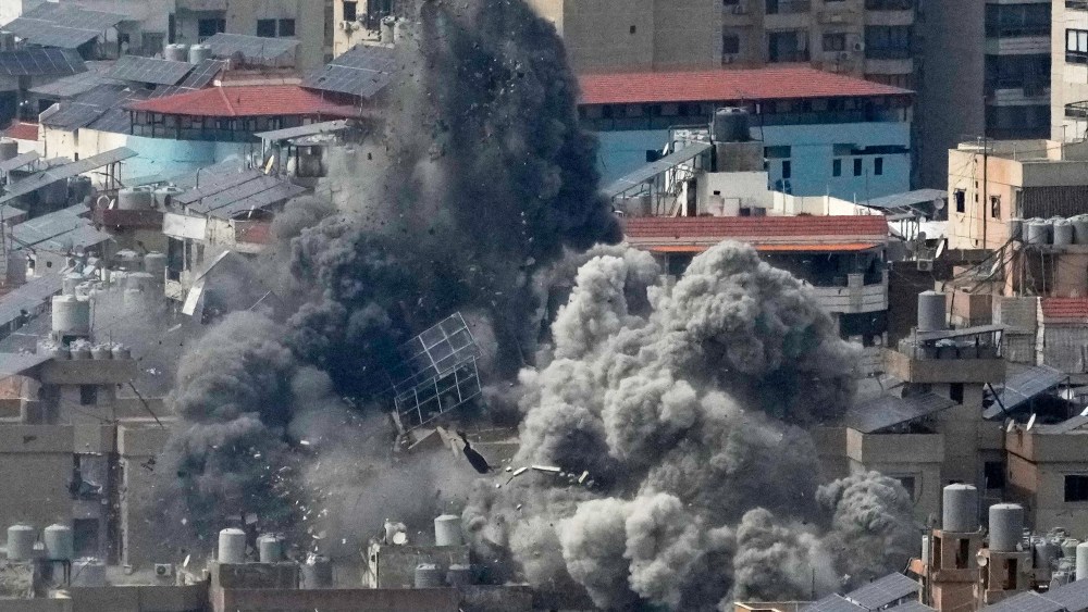Smoke rises following an Israeli airstrike in Beirut's southern suburbs.